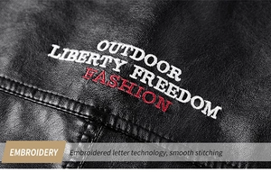 Detail of high-density outdoor liberty embroidery on black faux leather jacket texture