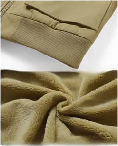 Detail of khaki men jacket featuring ribbed hem and thick beige faux fur warm lining
