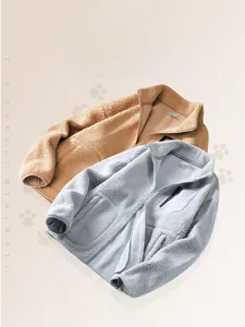 Close-up of thick teddy fleece jackets with high collar and contrast chest pocket