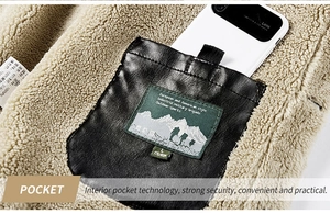 Detail of inner PU leather pocket with smartphone showing storage on fleece jacket
