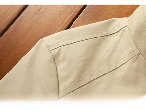 Close-up of khaki cotton jacket shoulder with high-quality double-stitch sewing detail