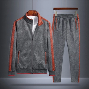 Men's grey tracksuit with orange accents, zip-up jacket and matching jogger pants