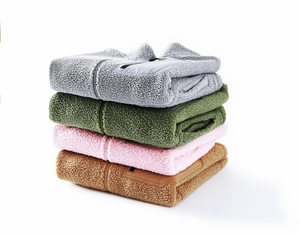 Stack of thick fleece jackets in grey, olive, pink and beige with front chest pockets