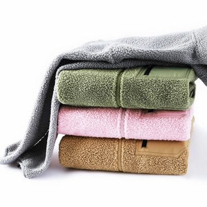Close-up of multicolored fleece jackets with zippers and contrast nylon chest pockets