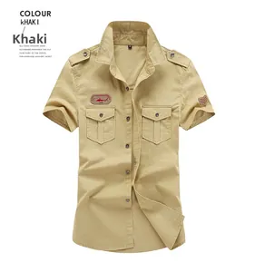 Detail of khaki short-sleeve work shirt with double chest pockets and military embroidery