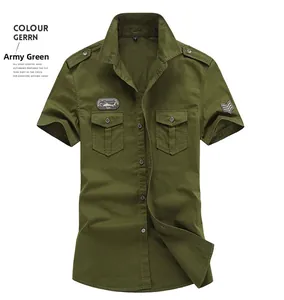 Detailed close-up of military green cotton cargo shirt with embroidered patches and epaulettes