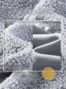 Detailed comparison of gray teddy fleece fabric texture and smooth inner lining material