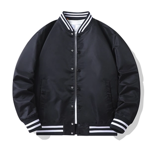 Detail of black flight jacket with striped ribbed collar and metal snap buttons