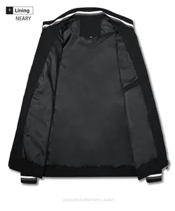 Close-up of black bomber jacket interior lining with size tag and striped rib collar