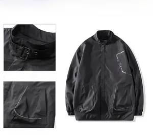 Detail of black men's windbreaker featuring high collar with buckle and YSLB print