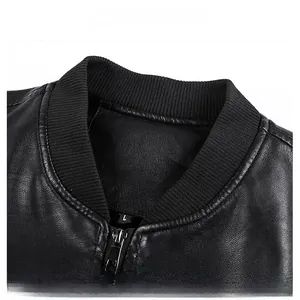 Detail view of the black leather jacket featuring elastic ribbed collar and silver metal zipper