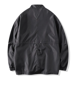Rear view of black windproof outdoor jacket with adjustable waist drawstring and elastic cuffs