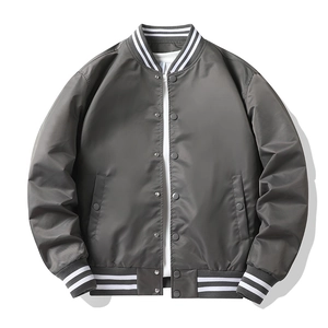 Detail view of striped ribbed collar and button closure on dark grey flight bomber jacket