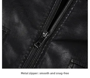 Close-up of durable metal zipper on black faux leather jacket with lychee grain texture
