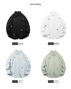 Detailed view of long-sleeve shirts in black, white, light blue and green with embroidery