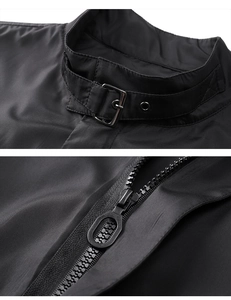 Detail of black jacket stand collar with metal buckle strap and textured resin zipper