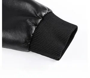 Detail view of black faux leather jacket featuring elastic knitted ribbed cuffs for comfort