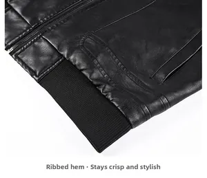 Detail shot of the black leather jacket featuring a high-quality ribbed hem and metal zipper