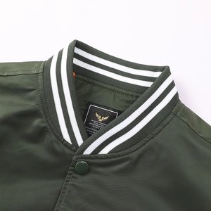Detail view of military bomber jacket with striped ribbed collar and orange lining