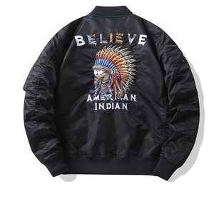 Detail of a black bomber jacket featuring intricate eagle embroidery on the back panel