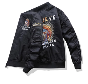 Detail of black bomber jacket featuring embroidered Indian chief pattern and ribbed cuffs