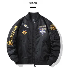 Detail of black flight jacket featuring tactical embroidery patches and sleeve utility pocket