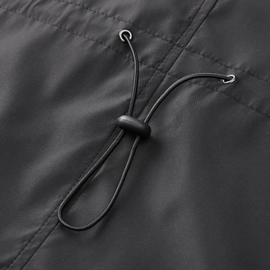 Men's casual black jacket detail featuring adjustable drawstring with plastic toggles