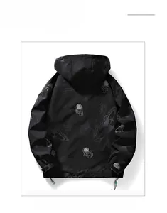 Detail of men's black hooded jacket with astronaut space print and adjustable drawstring