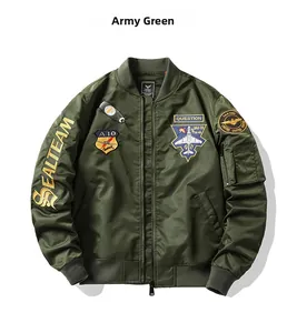 Detail of army green bomber jacket featuring military embroidery and smooth nylon texture