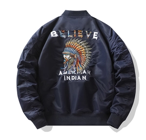 Detailed embroidery of an Indian eagle head on the back of a navy bomber jacket