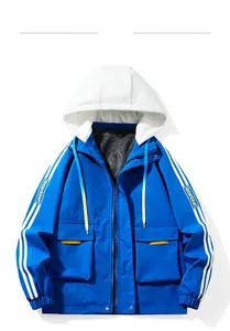 Detail of blue and white color-block jacket with detachable hood and striped sleeves