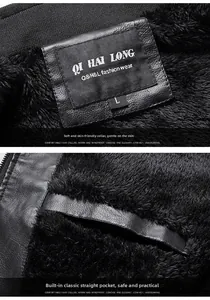 Detailed macro view of the black leather jacket showing warm plush lining and inner pocket