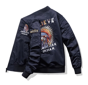 Detailed view of intricate eagle and Indian chief embroidery on navy blue bomber jacket