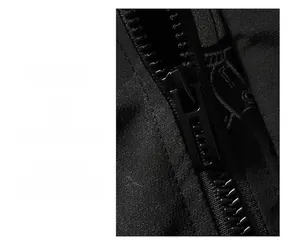 Detail of high-quality black zipper and anime robot print on streetwear jacket