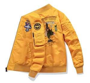 Detailed embroidery on back of bright yellow flight bomber jacket with fighter jet motif