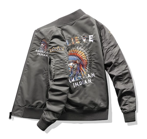 Macro detail of high-quality Indian chief embroidery on dark grey bomber jacket