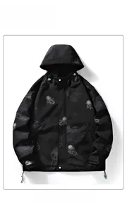 Detail of hooded windbreaker featuring astronaut print and adjustable velcro cuffs