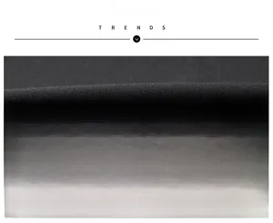 Close-up of premium black stretch fabric with soft texture for men's business jackets