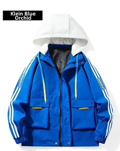 Detail of blue and white color-block cargo jacket with Recursion embroidery and hood