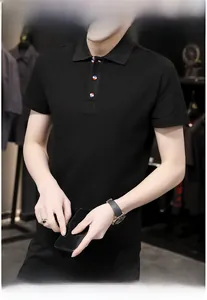 Detail of black polo shirt featuring distinctive red white and blue striped button accents