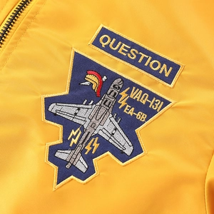 Men's yellow bomber jacket featuring premium aviation embroidery and military badges