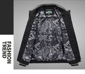 Detail of men's bomber jacket with striped ribbed collar and urban map pattern lining
