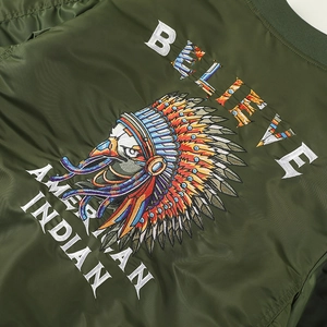 Army green bomber jacket featuring detailed native American eagle embroidery and text