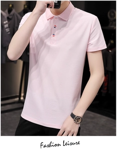 Detail of pink men's polo shirt with unique tricolor patterned buttons and ribbed collar