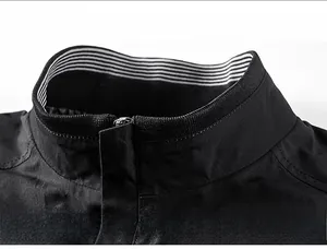 Detail view of the windproof stand-up collar and black and white striped ribbed inner lining
