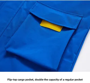 Macro view of blue utility jacket with large flap pocket and yellow contrast trim