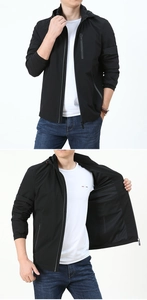 Detail of men's black hooded jacket featuring breathable mesh lining and secure zipper pockets