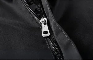 Detailed close-up of premium metal zipper and durable twill fabric on men's casual jacket