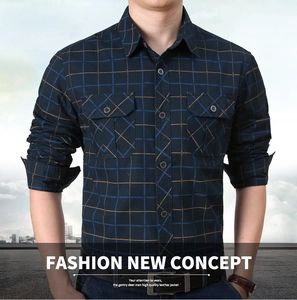 Front view detail of a men's plaid outdoor shirt with dual chest pockets and button down front