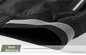 Detail of black elastic ribbed hem with double white stripes and reinforced stitching